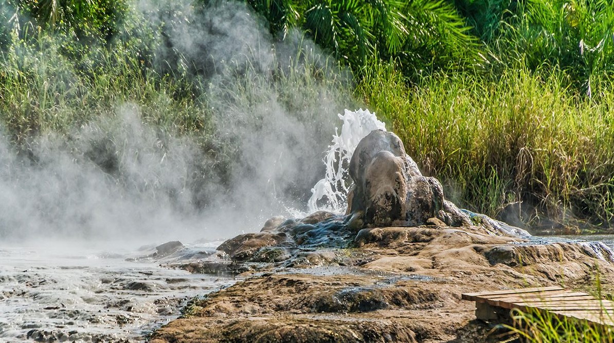 Explore the Semuliki hot springs on your Sempaya Uganda travel: a guided forest walk, steaming geothermal springs over 100°C, and cultural legends