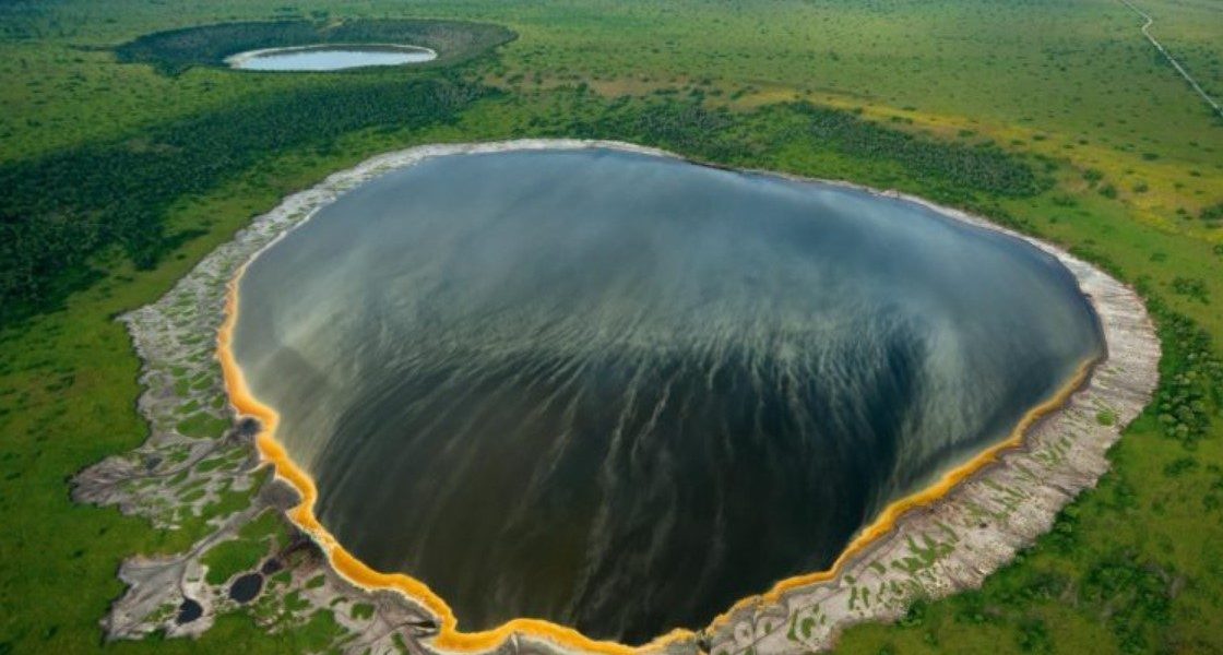 Crater lakes in Queen Elizabeth National Park: The Ugandan government gazetted the park to preserve its mammals, 10 primate species, and tree-climbing lions